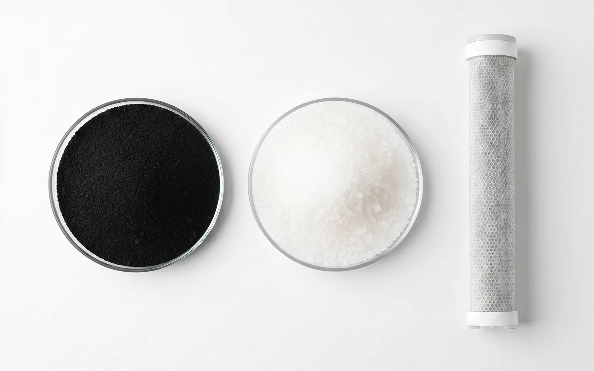 Two air filter components and a showerhead filter on a white background