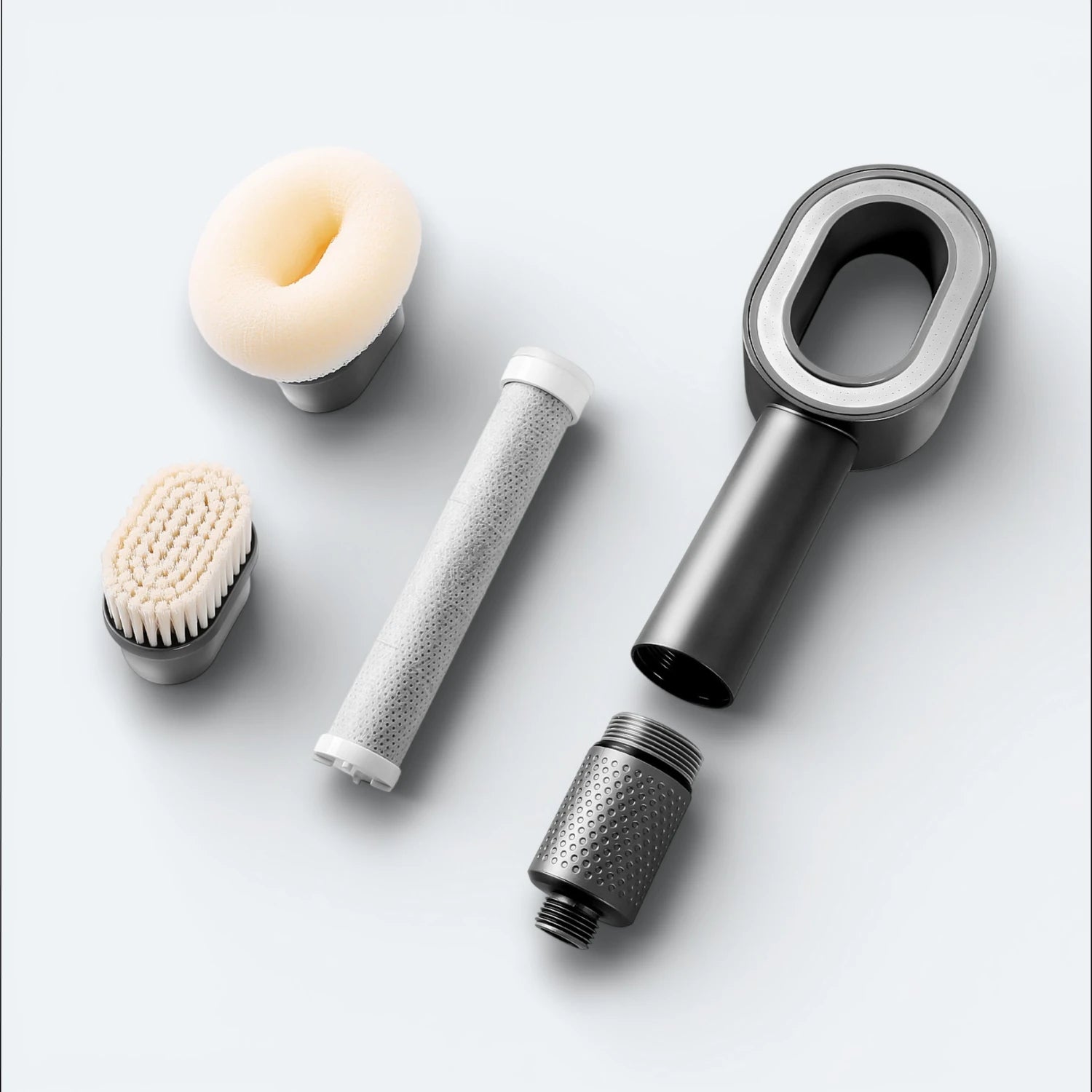 Collection of grooming tools including a shower head, filter, sponge, and brush, on a light blue background #Color=Gray